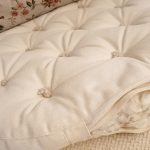 Cottoned-round-tufted-floor-cushion-with-organic-cotton-filling-stuffing-detail